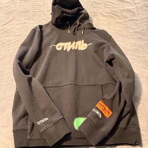 Heron Preston Black Hoodie with Beige Logo and Green Accent